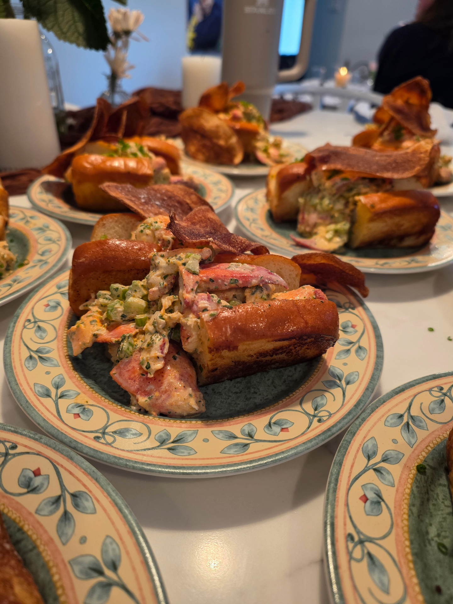 Brioche lobster rolls with house chips plated for a private dinner party at the Jersey Shore