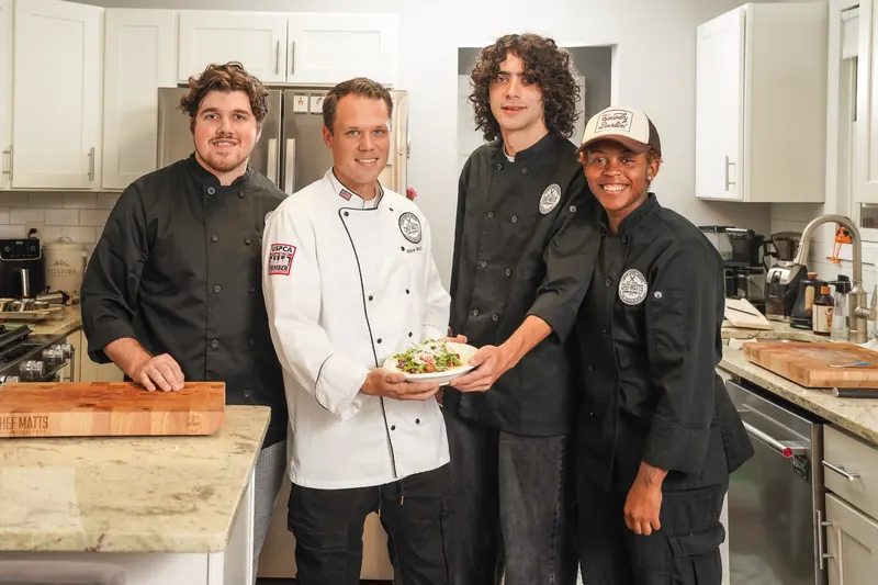 Chef Matt with the Chef Matts Culinary Creations team in a client's kitchen